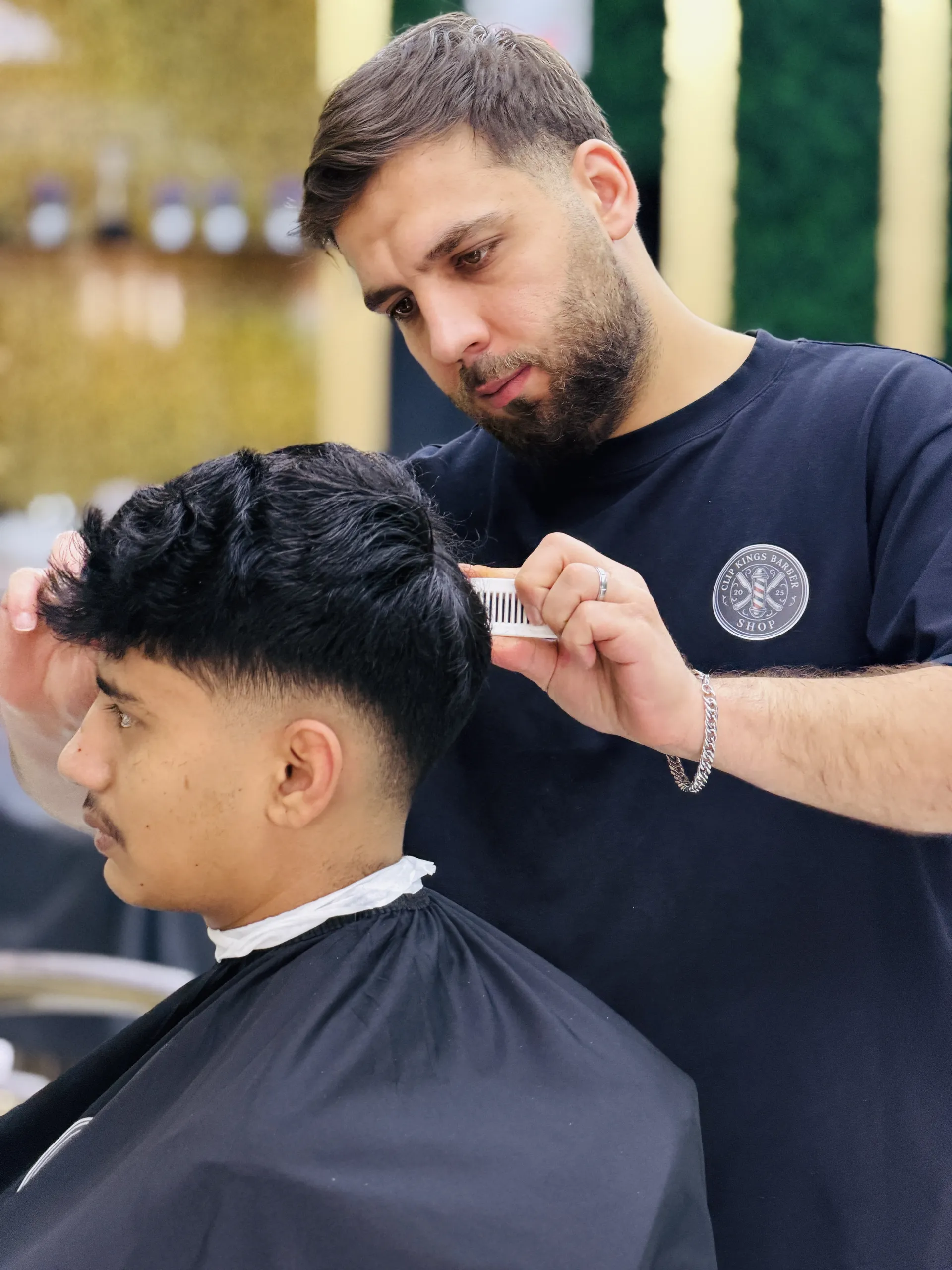 Master barber performing a precision haircut