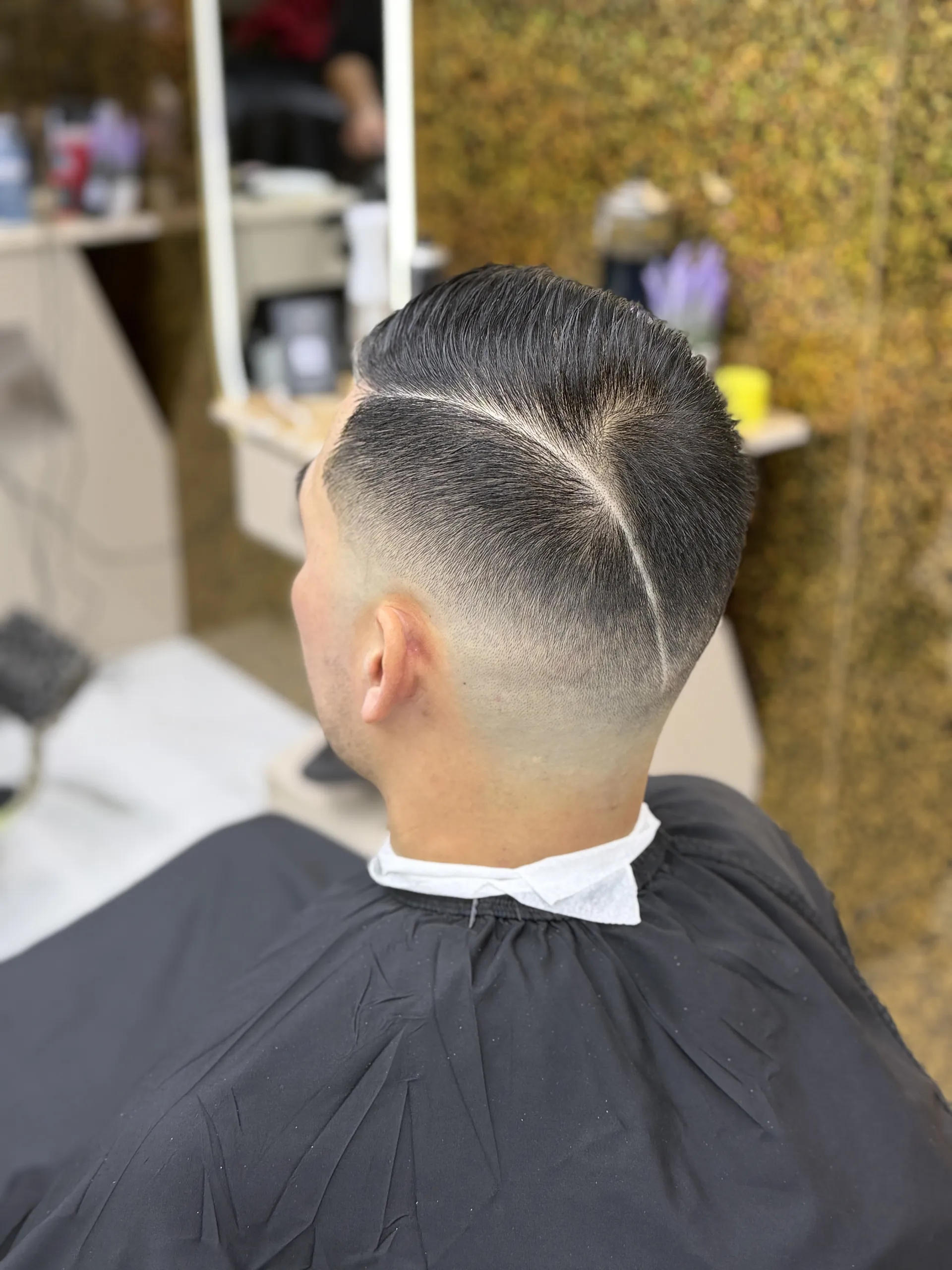 Client after a masterful fade and styling